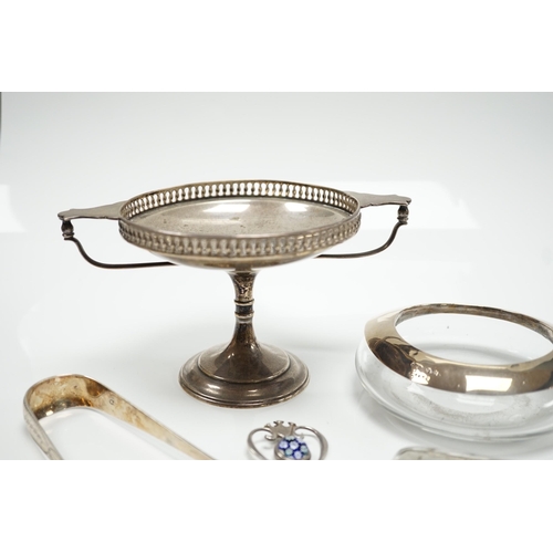 821 - A George V silver tazza, a silver cigarette case, a pair of George III silver sugar tongs, a silver ... 