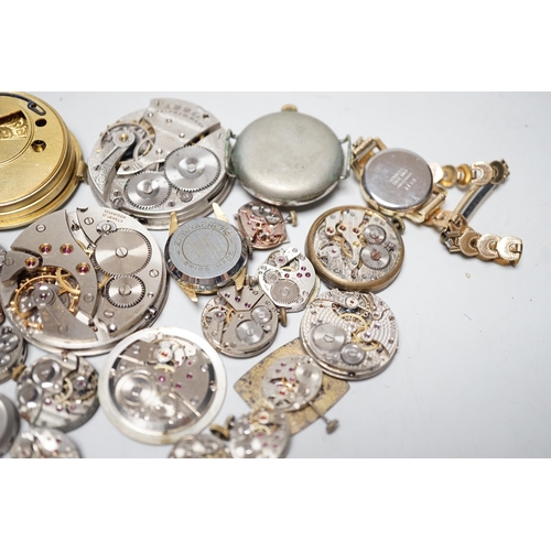 1990 - A collection of assorted wrist and pocket watch parts.