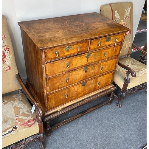 1004 - An 18th century feather banded walnut chest on stand, width 96cm, depth 58cm, height 109cm