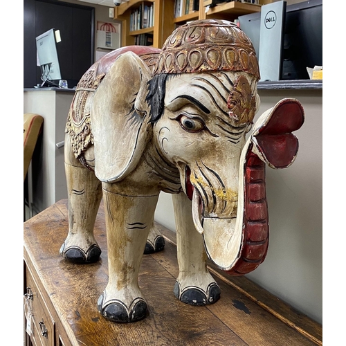 1006 - A large Indonesian painted wood model of an elephant, length 92cm, height 60cm