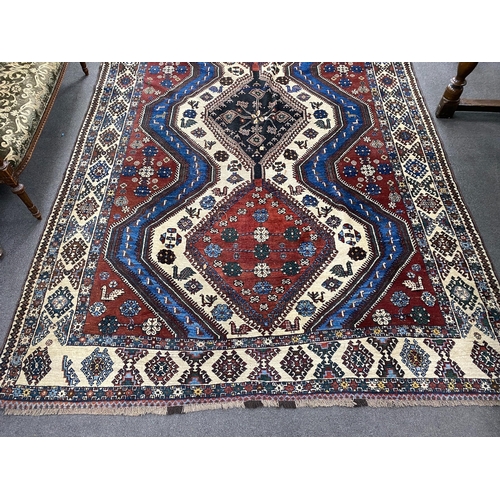 1009 - A Caucasian red ground carpet, 335 x 214cm