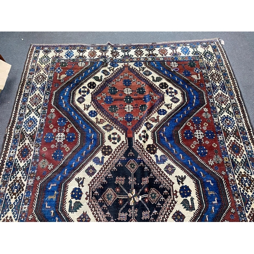 1009 - A Caucasian red ground carpet, 335 x 214cm