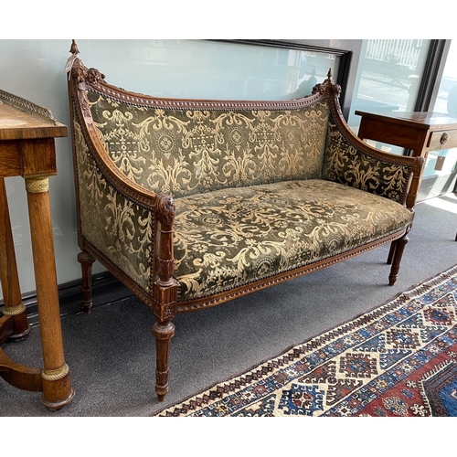 1012 - A continental carved walnut settee, length 128cm, depth 54cm, height 90cm