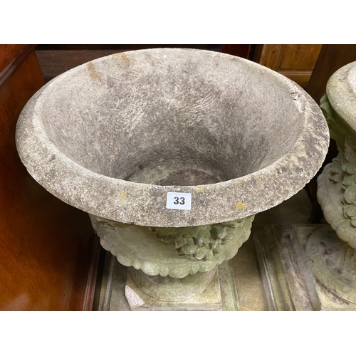 1033 - A pair of circular reconstituted campana garden urns with floral swagged bodies, diameter 59cm, heig... 