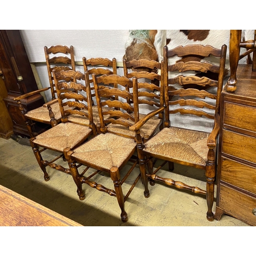 1052 - A set of eight reproduction elm and beech rush seat ladder back dining chairs, two with arms