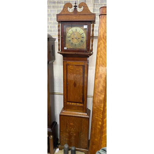 1055 - A late 18th century country oak and mahogany crossbanded longcase clock, the 11in. square brass dial... 