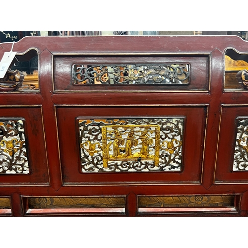 1068 - A Chinese scarlet lacquer parcel gilt bench, length 125cm, depth 70cm, height 97cm