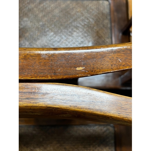 1069 - A pair of Chinese caned hardwood elbow chairs, width 55cm, depth 44cm, height 97cm