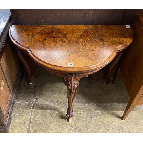 1090 - A Victorian figured walnut D shaped folding card table, width 100cm, depth 51cm, height 74cm