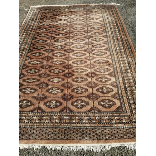 1112 - A Bokhara peach ground carpet, 280 x 186cm