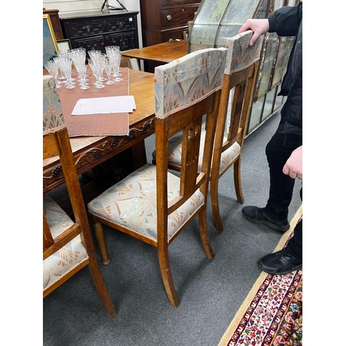 1116 - A set of Art Nouveau carved oak dining chairs, one with arms with original Liberty receipt