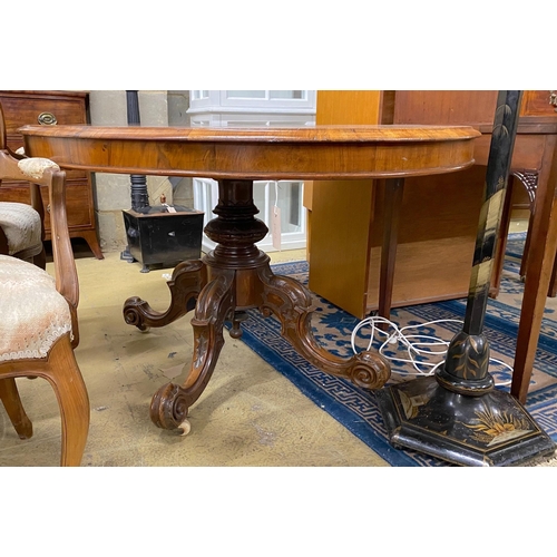 1131 - A Victorian oval figured walnut tilt top loo table, length 146cm, width 110cm, height 72cm