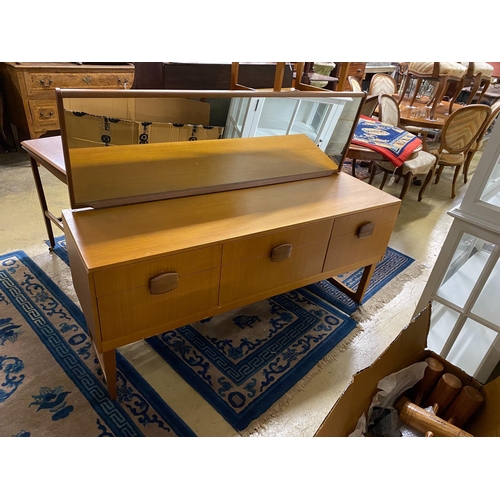 1135 - A mid century teak dressing table, width 147cm, depth 43cm, height 112cm, together with a stool, che... 