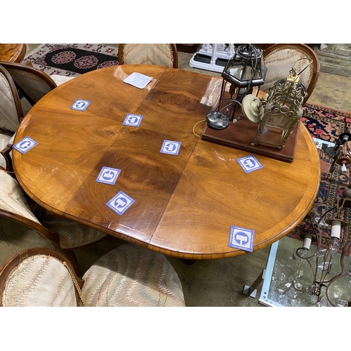 1138 - A Queen Anne Revival oval walnut extending dining table, length 162cm extended, one spare leaf, widt... 