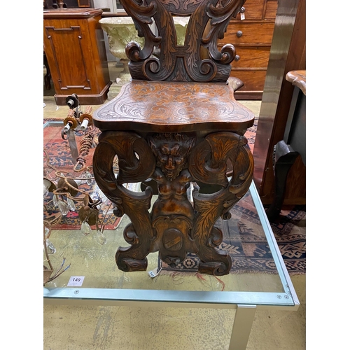 1139 - An early 20th century Italian carved walnut hall chair, height 108cm