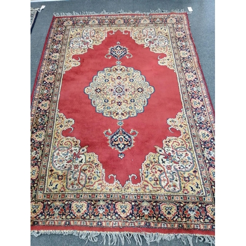 1199 - A Belgian machined red ground rug, in Kerman style, 190 x 131cm