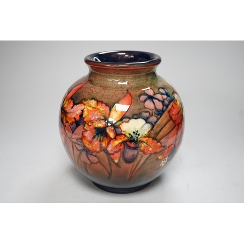 1253 - A Moorcroft flambé orchid globe shaped vase, 21cm