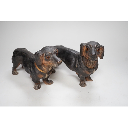 1257 - A pair of Austrian cold painted terracotta models of Dachshunds, one paw damaged, inset glass eyes 2... 