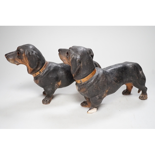 1257 - A pair of Austrian cold painted terracotta models of Dachshunds, one paw damaged, inset glass eyes 2... 