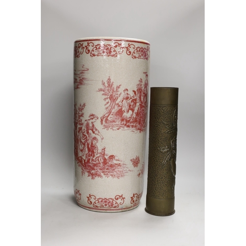 1307 - A 20th century crackle ware pottery stick stand, with toile de jouy all over design and a trench art... 