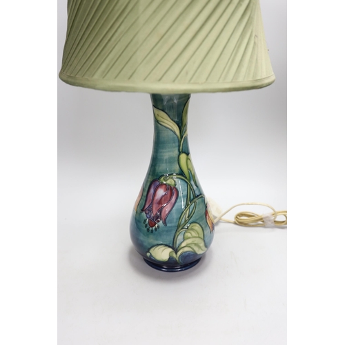 1312 - A 20th century Moorcroft lamp, stamped and with a Moorcroft label on the base, 35cms high (not inclu... 