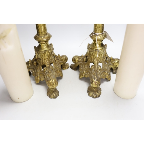 1314 - A pair of tall Victorian ecclesiastical brass candlestands, 51cms high