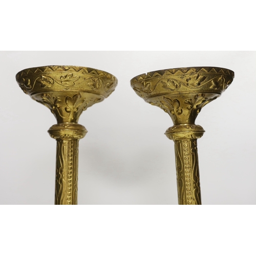 1314 - A pair of tall Victorian ecclesiastical brass candlestands, 51cms high