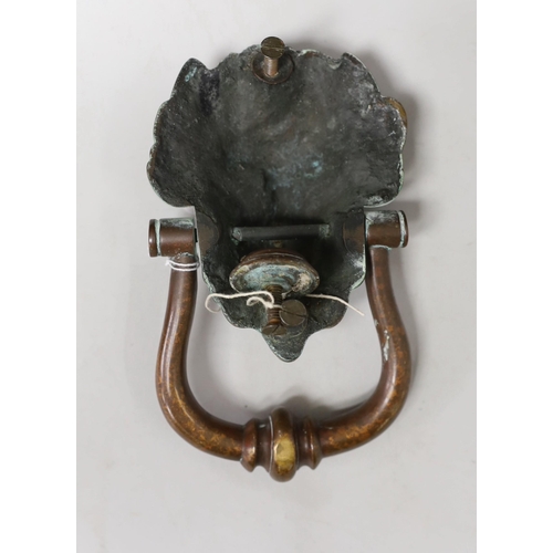 1358 - A large bronze lion mask door knocker. 20cm tall overall