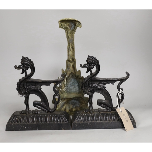 1370 - A pair of cast iron seated lion dog doorstops, together with A brass pineapple shaped door porter. T... 