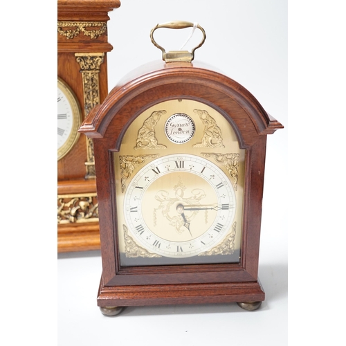 1377 - A Garrard clock and an oak brass mounted clock 29cms high,