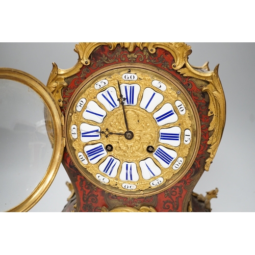 1382 - A French scarlet Boulle work and ormolu mounted mantel clock with enamel dial, 45cms high