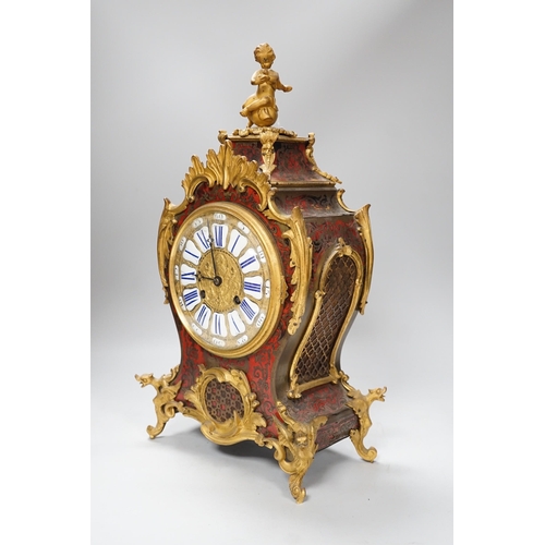 1382 - A French scarlet Boulle work and ormolu mounted mantel clock with enamel dial, 45cms high