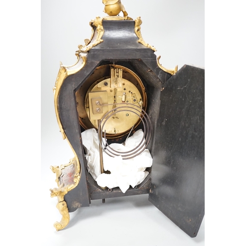 1382 - A French scarlet Boulle work and ormolu mounted mantel clock with enamel dial, 45cms high