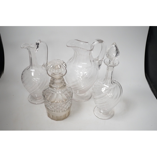 1393 - Two Victorian cut glass decanters, a ewer and a jug. Tallest 32cm