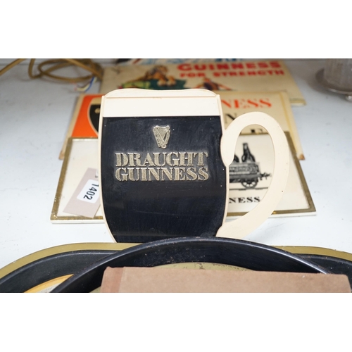 1402 - Five Guinness advertising signs, mirror,  trays and a book - St. Jamess Gate Brewery History and Gu... 