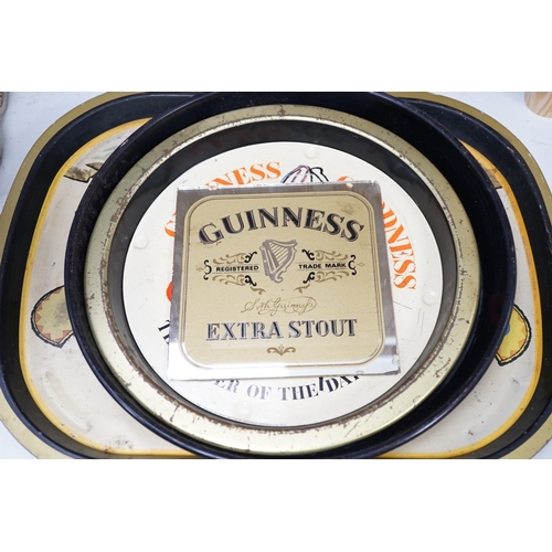 1402 - Five Guinness advertising signs, mirror,  trays and a book - St. Jamess Gate Brewery History and Gu... 