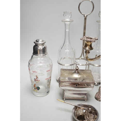 1404 - Assorted plated items including a decanter stand with two bottles, by Hukin & Heath and a tea caddy ... 