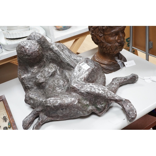 1405 - A large heavy cast metal abstract figure group, recumbent couple 67cm