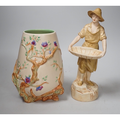 1415 - A Royal Dux figure of a water carrier and a Clarice Cliff for Newport Pottery vase. Tallest 27cm... 