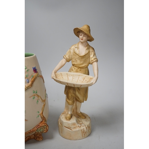 1415 - A Royal Dux figure of a water carrier and a Clarice Cliff for Newport Pottery vase. Tallest 27cm... 