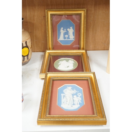 1423 - Three framed Wedgwood Jasper ware plaques (one cracked),largest 14.5cms high