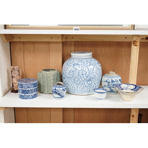 1445 - A group of 19th century blue and white jars, a stacking food box and two bowls, together with a cela... 