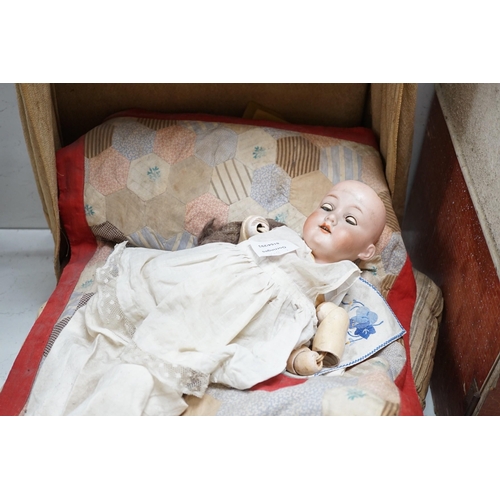 1480 - An Armand Marseille 390 A 11/2 M porcelain doll and a half tester wooded bed, bed 55cms deep x 55cms... 