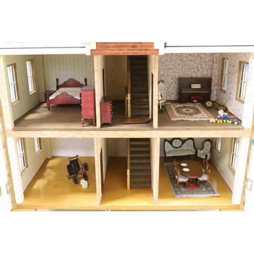 1482 - A mid 20th century doll's house and contents, 84cms x 100cms high