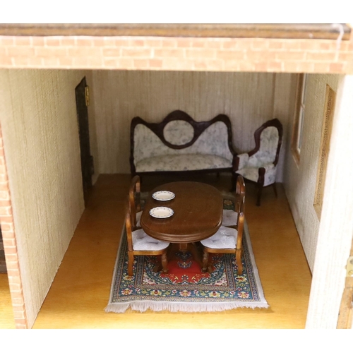 1482 - A mid 20th century doll's house and contents, 84cms x 100cms high