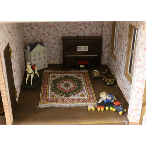 1482 - A mid 20th century doll's house and contents, 84cms x 100cms high