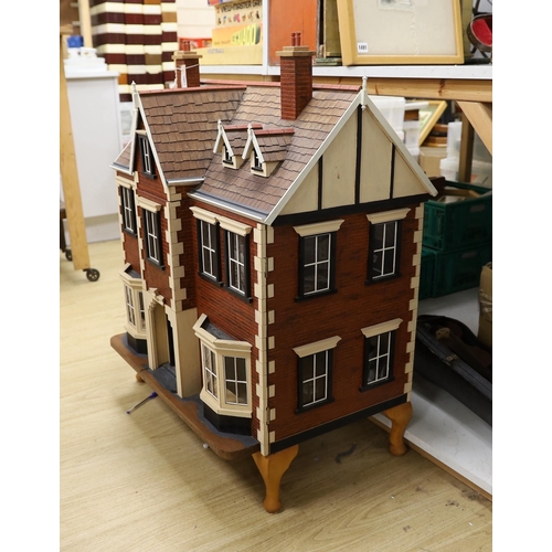 1482 - A mid 20th century doll's house and contents, 84cms x 100cms high