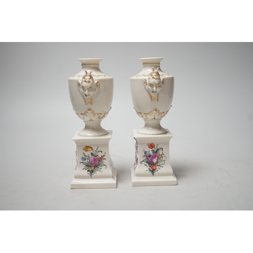 1492 - A pair of Nymphenburg urns, marked to base. 15.5cm tall