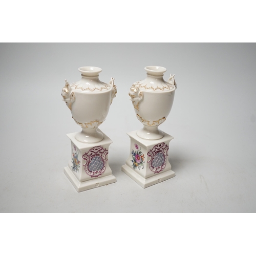 1492 - A pair of Nymphenburg urns, marked to base. 15.5cm tall