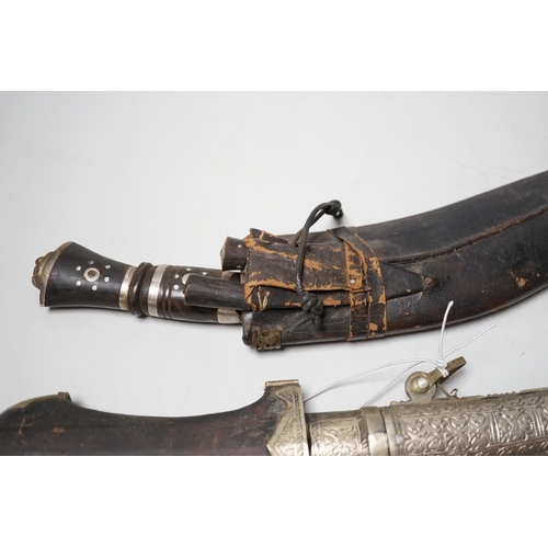 1523 - Two Kukri and eastern daggers, within engraved sheath, (3)